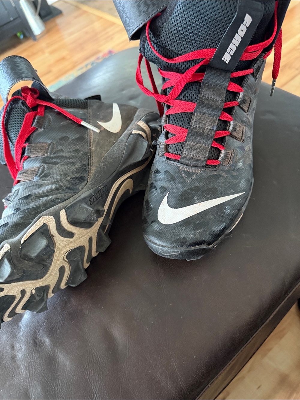 Nike men’s force Black cleats with Red Laces and White Swoosh